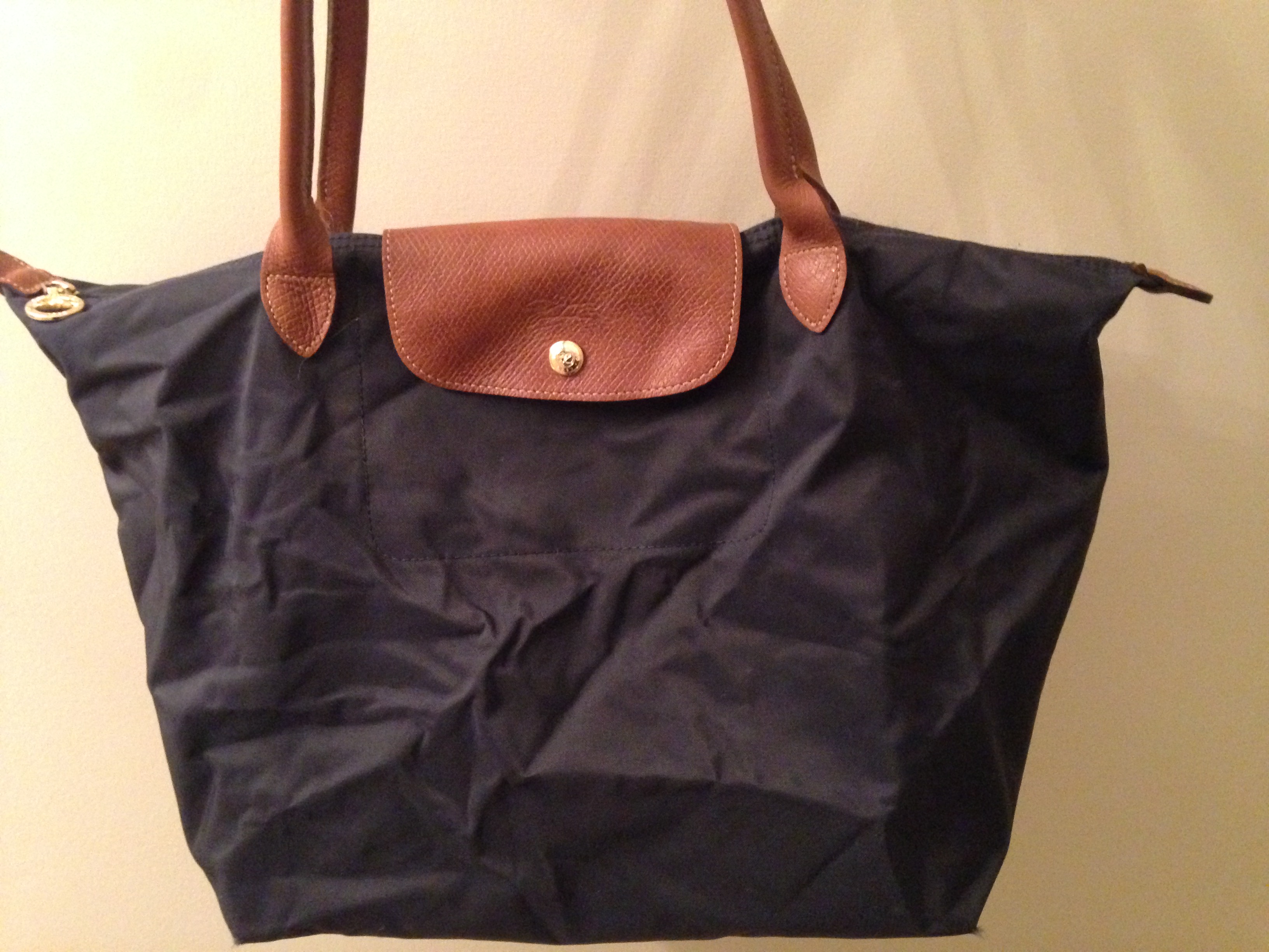 how to clean a longchamp purse